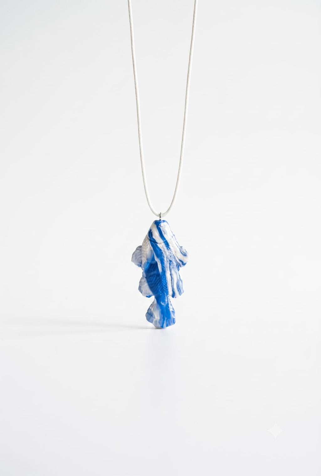 White fish pendant