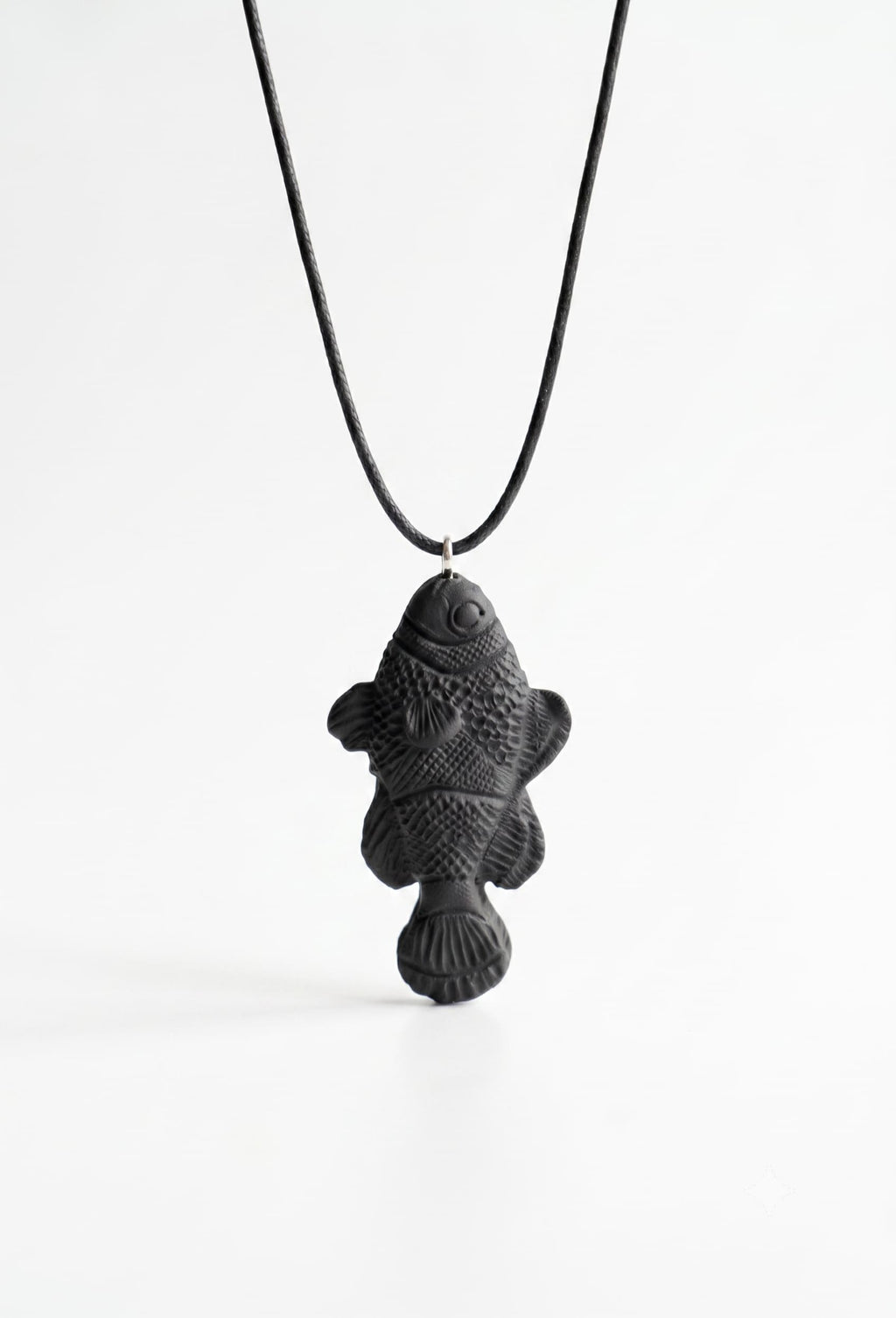 White fish pendant