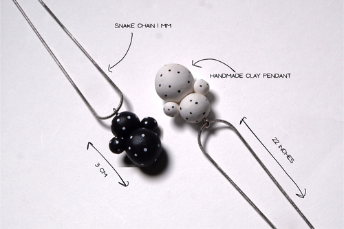 Black Dot Doll Pendant