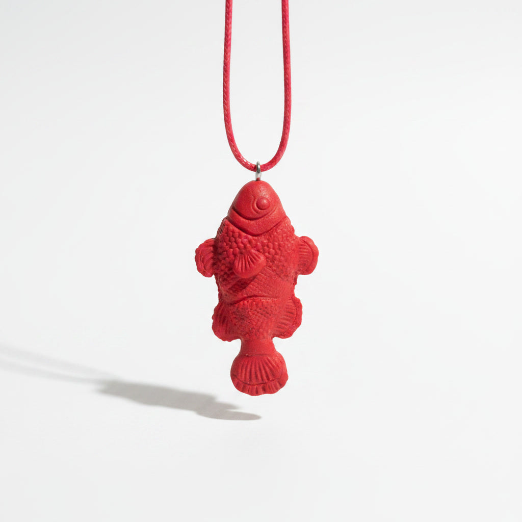 White fish pendant